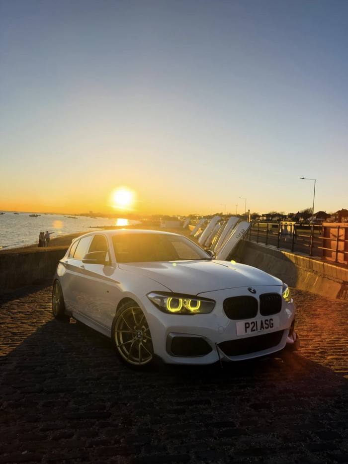 White BMW at sunset on a slipway